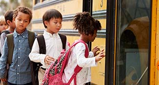 LC-school-bus-elementary-school-students-boarding-school-bus.jpg